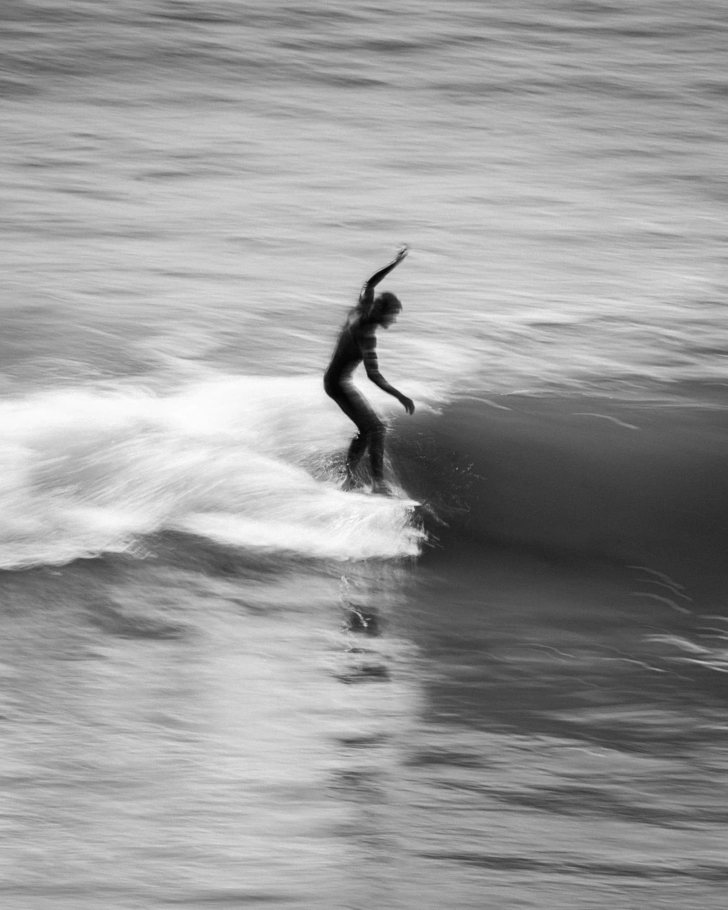 Surfer carving down the line