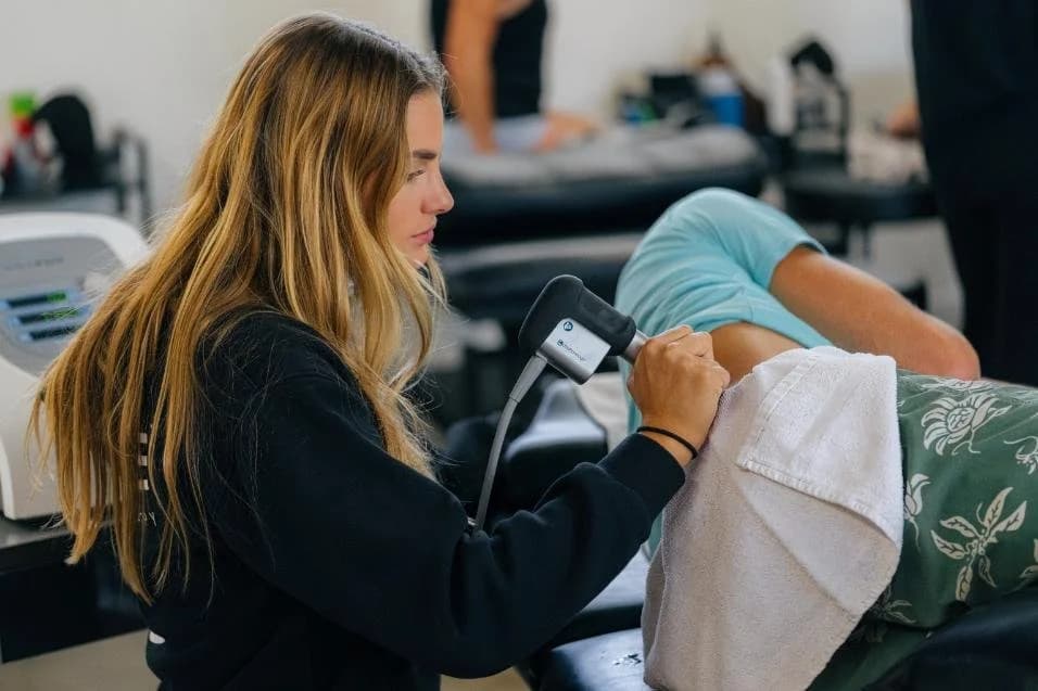 Percussion therapy on a patient at Range Sports Therapy